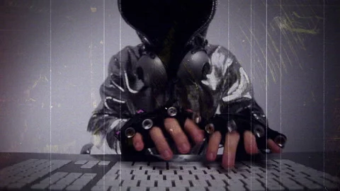 Computer hacker in silver jacket Stock Footage 144771957