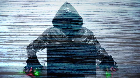 Computer hacker in silver jacket Stock Footage 144772110