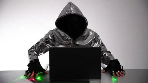 Computer hacker in silver jacket Stock Footage 144772238