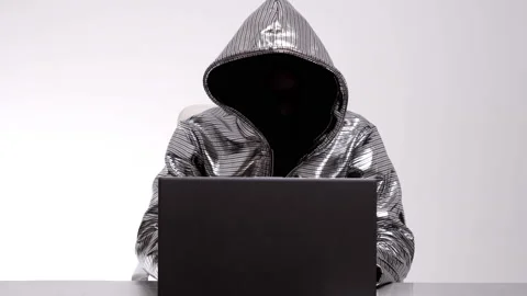 Computer hacker in silver jacket Stock Footage 144773088