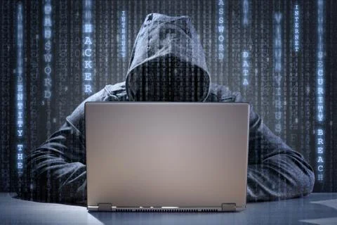 Computer hacker stealing data from a laptop Stock Photos