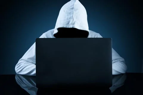 Computer hacker stealing data from a laptop concept for network security Foto stock