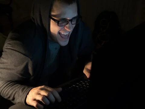 Computer hacker stealing information with laptop Stock Photos