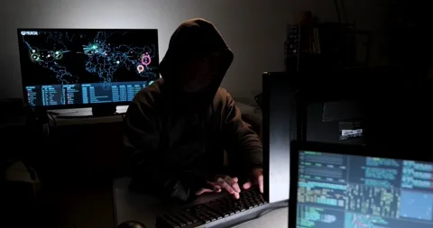 Computer hacker types code attempting to hack a computer server Stock Footage 154567555