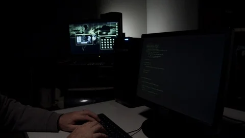 Computer hacker typing in code 스톡 동영상 107905113