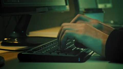 Computer hacker typing code on keyboard late night working. Stock Footage 106351338
