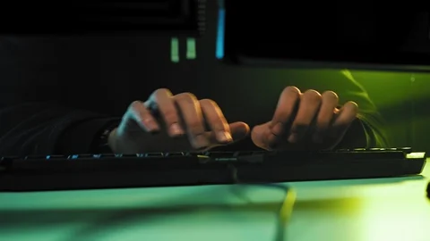 Computer hacker typing code on keyboard late night working. Stock Footage 111288174