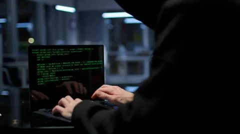 Computer hacker typing code on keyboard late night working and bypassing cyber 스톡 사진