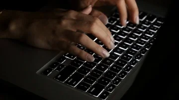 Computer hacker typing on keyboard. Fast Motion (ECU -CU) Stock Footage 85481043