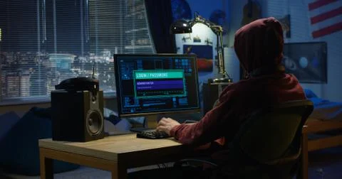 Computer hacker using his computer 스톡 사진