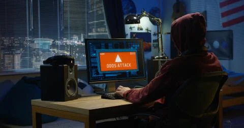 Computer hacker using his computer Foto stock