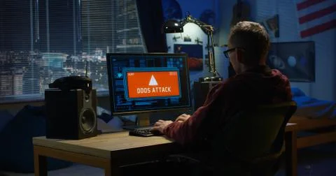 Computer hacker using his computer Foto stock