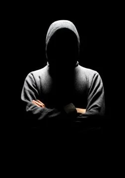Computer hacker in white mask and hoodie. Obscured dark face. Data thief Stock Photos