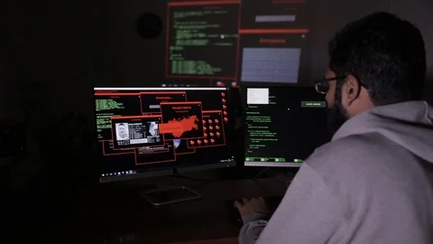 Computer hacker working. Computer code reflected on face 스톡 동영상 69878655