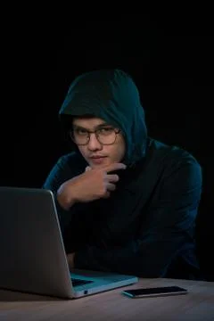 Computer hacker working in dark room 스톡 사진