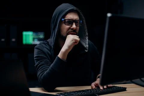 Computer hacker working at night Stock Photos