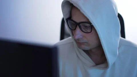 Computer hacker works at a computer Stock Footage 277341417