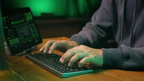 Computer hacker's hand typing code on keyboard Stock Footage 280177630