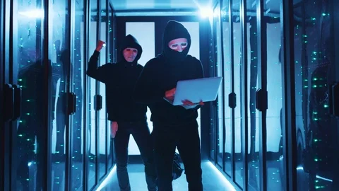 Computer hackers team breaking into database cyber server room. Successful spies Stock Footage 120695446