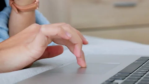 Computer hand scroll of a person web research, data reading or doing a internet Stock Footage 206643098