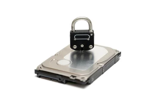 Computer hard disk and metal padlock symbolizing concept for encrypted data,  Stock Photos
