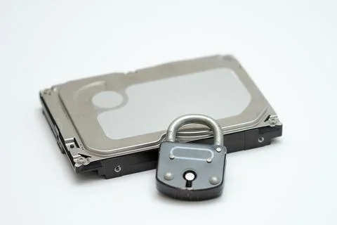 Computer hard disk and metal padlock symbolizing concept for encrypted data,  Stock Photos
