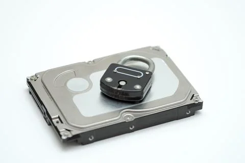 Computer hard disk and metal padlock symbolizing concept for encrypted data,  Foto stock