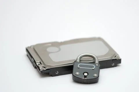 Computer hard disk and metal padlock symbolizing concept for encrypted data,  Foto stock