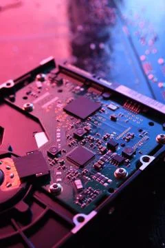 Computer Hard disk drives HDD , SSD on circuit board ,motherboard background. Stock Photos