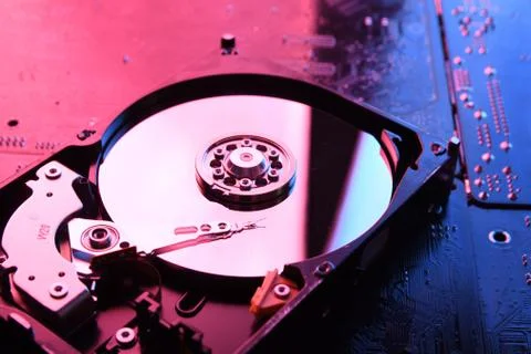 Computer Hard disk drives HDD , SSD on circuit board ,motherboard background. Stock Photos