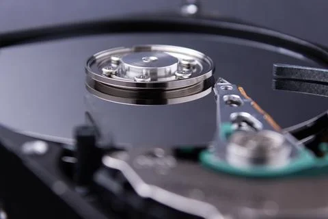 Computer hard disk from inside close up. Detail of a computer. Stock Photos