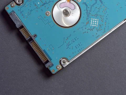 Computer hard disk top view close up on a dark paper background Stock Photos