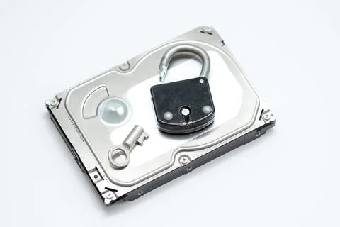 Computer hard disks and open metal padlock symbolizing concept for encrypted  Stock Photos