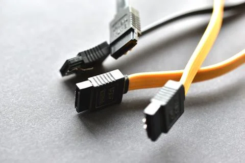 Computer hard drive plugs on black background Stock Photos