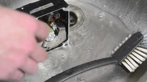 Computer hard drive under running water. Stock Footage 220726172