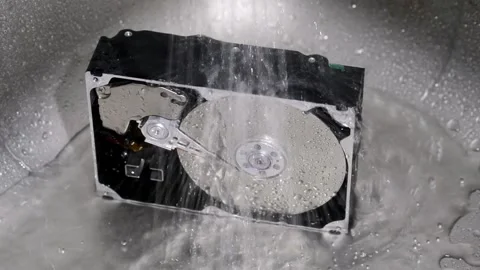 Computer hard drive under running water. Stock Footage 220726185
