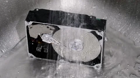 Computer hard drive under running water. Stock Footage 220726341