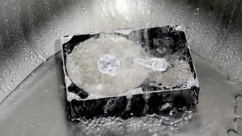 Computer hard drive under running water. Stock Footage 220726704