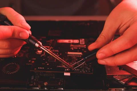 Computer hardware engineering. developer soldering electronic component Stock Photos