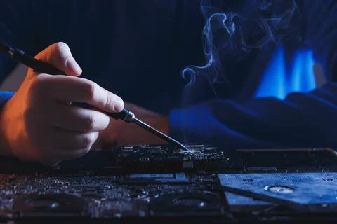 Computer hardware engineering. developer soldering electronic component 写真素材