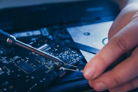 Computer hardware engineering. developer soldering electronic component 写真素材
