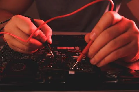 Computer hardware engineering. developer soldering electronic component Stock Photos