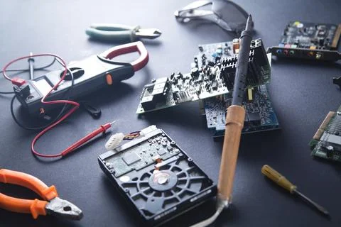 Computer hardware engineering. Soldering computer motherboard Stock Photos