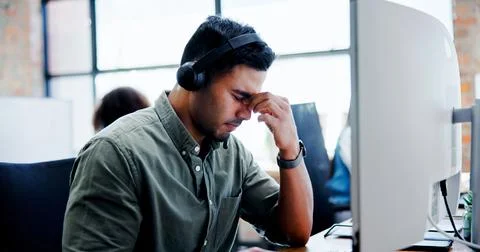 Computer, headache and stress with man in call center for assistance, feedback 스톡 사진