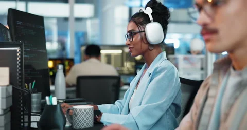 Computer, headphones and smile of programmer woman at desk in office for Stock Footage 309038268