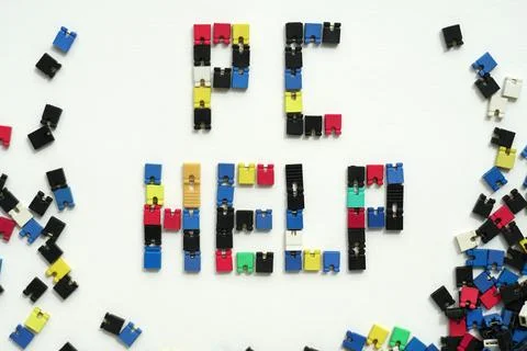 Computer Help. IT Service. PC Support. Close-up of computer jumpers text PC HELP Stock Photos