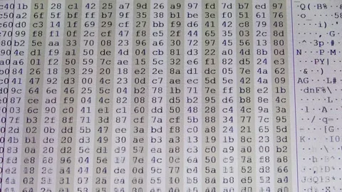 Computer hexadecimal code scrolling on a screen Stock Footage 323478560