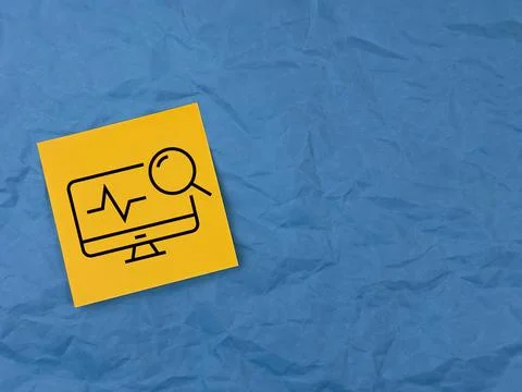 A computer icon from a medical post is painted on office paper. medical care  Foto stock