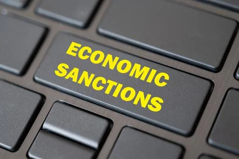 Computer key, with "economic sancions" text. Response to the war. Stock Photos