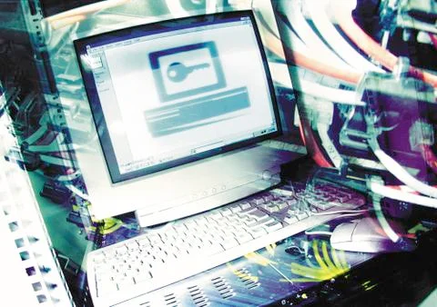 Computer with key on screen, digital composite. Stockfoto's
